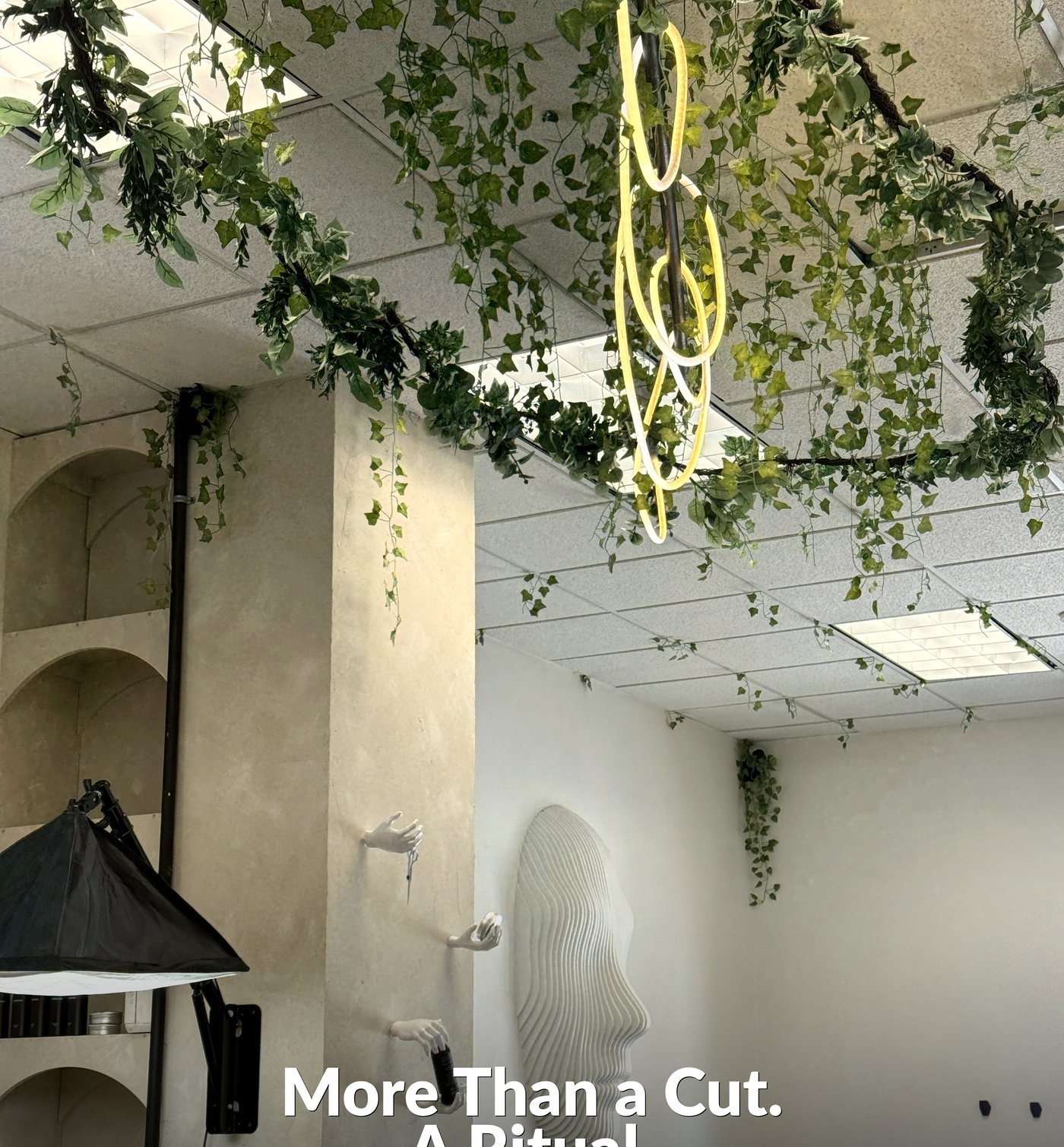 ALMAAN Barber Studio — face sculpture and ALMAAN letters