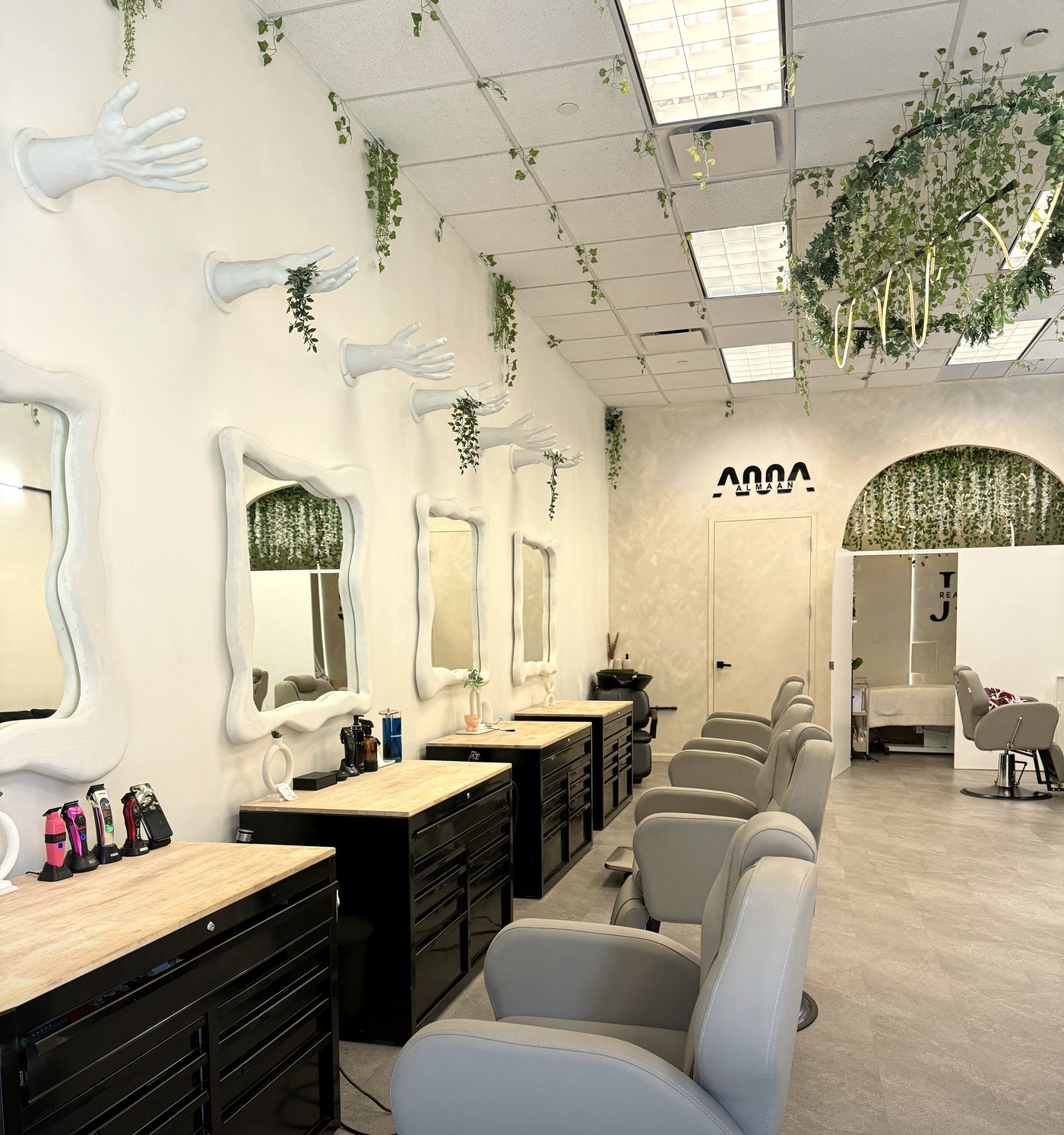 ALMAAN studio — wide interior view with barber chairs